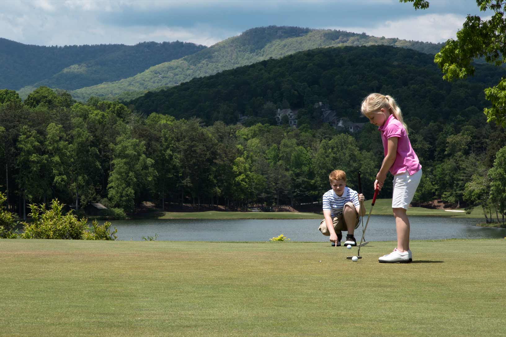 Children on the putting green at Big Canoe