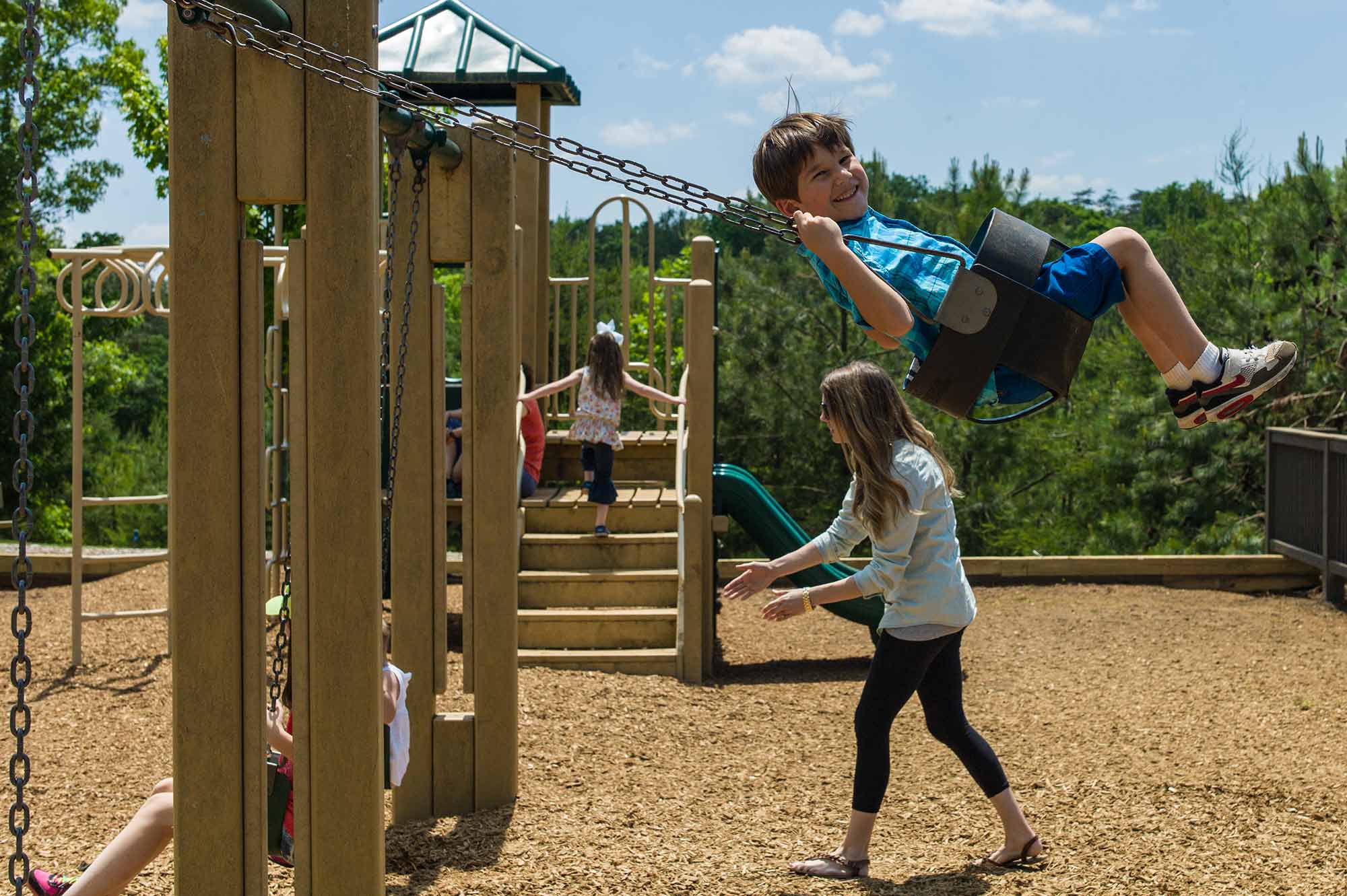 Kids swinging at Big Canoe playground